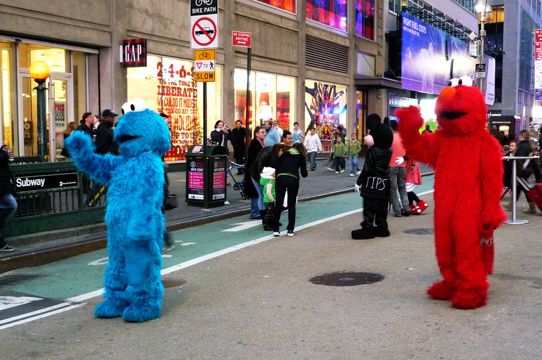 Aw, how can anyone hate the Times Square pedestrian plazas! They've even got a panhandling Mickey!